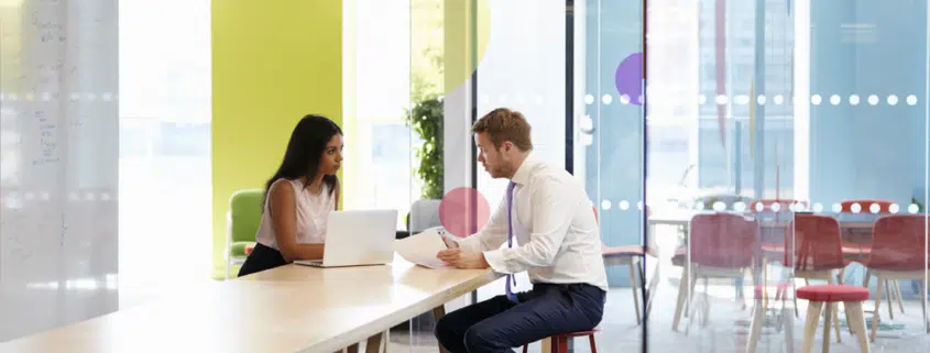 2 people meeting each other in office