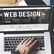laptop on desk showing web design
