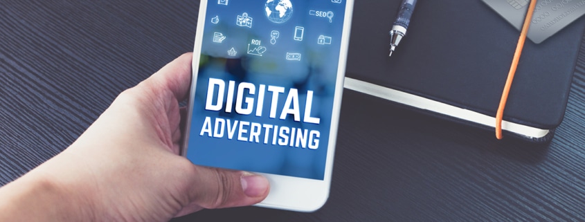 hand-holding-phone-reads-digital-advertising
