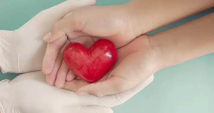 hands holding heart for healthcare emotional branding